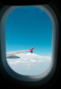 Airplane flying against clear blue sky