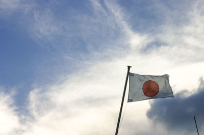 Low angle view of flag against sky japan flag