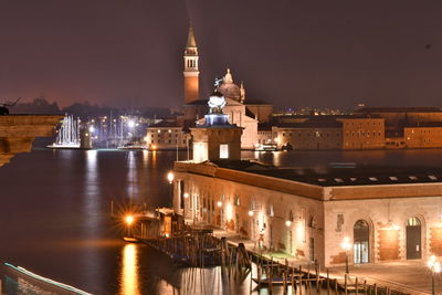 Illuminated buildings in city at night