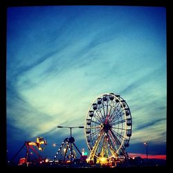 Low angle view of ferris wheel against sky