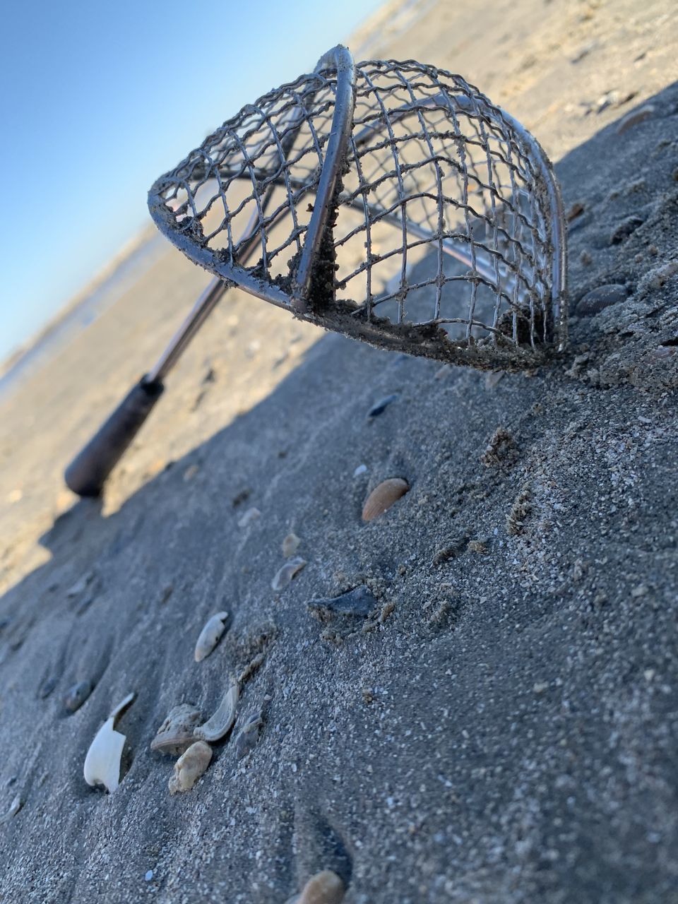 CLOSE-UP OF UMBRELLA ON BEACH