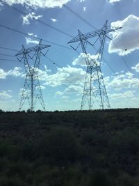 Low angle view of electricity pylon against sky