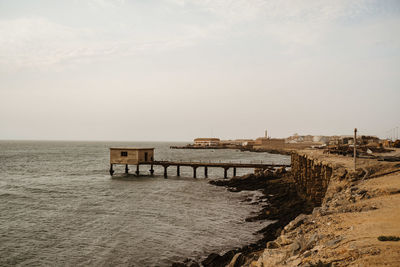 Pier over sea against sky