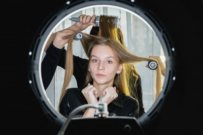 Portrait of young woman in car