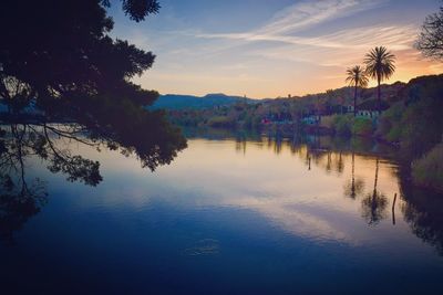 Scenic view of lake against sky during sunset