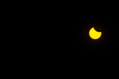 Low angle view of moon in the dark