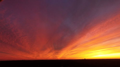 Scenic view of dramatic sky during sunset