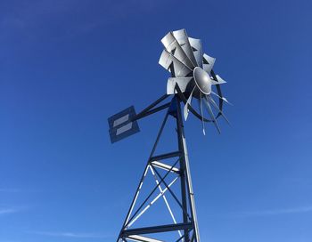 Low angle view of american-style windmill against sky