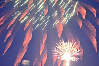 Low angle view of fire crackers at night