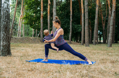 Mom and baby yoga outdoor classes. wellness, family yoga class, practicing mindfulness 