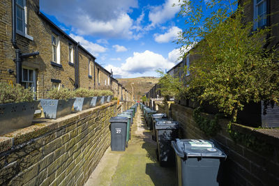 Looking down the back alley of terraced houses in saltaire, yorkshire