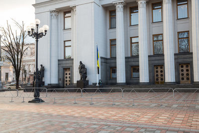 Street by building in city