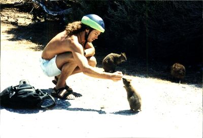 Full length of woman standing on wall