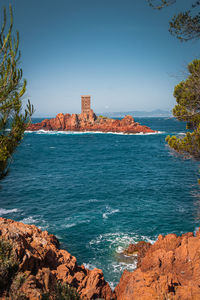 Scenic view of sea against clear blue sky