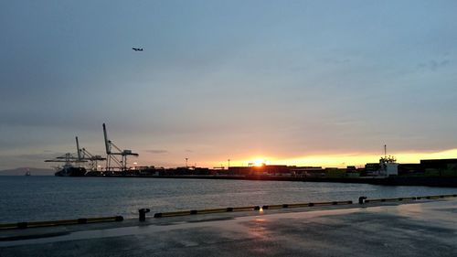 View of harbor at sunset