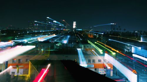 High angle view of light trails on road at night