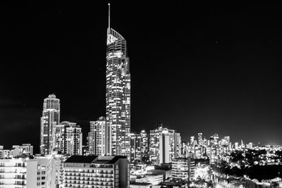 Illuminated buildings in city at night