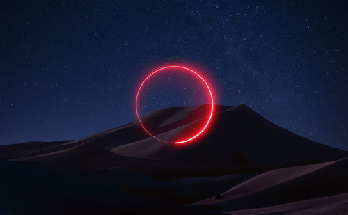 Light painting against sky at night