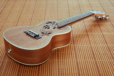 Close-up of guitar on table