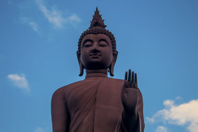 Low angle view of statue against sky