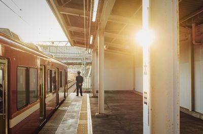 Man walking in illuminated corridor