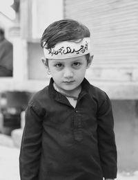 Portrait of boy standing on street