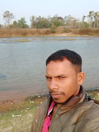 Portrait of man standing in water