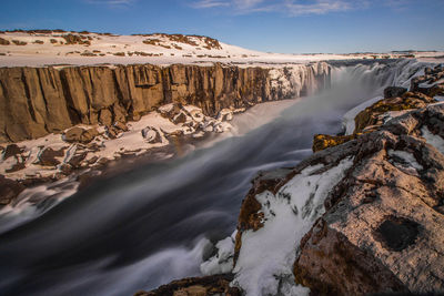 Scenic view of waterfall during winter