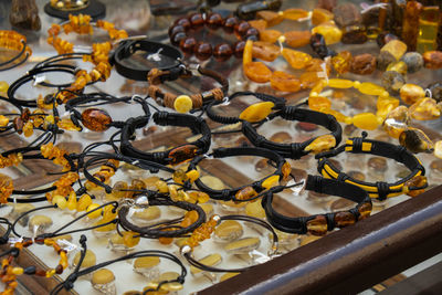 Colorful showcases of traditional jewelry stores and amber gemstone products in city market square