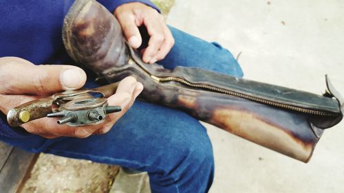 Close-up of man holding hands