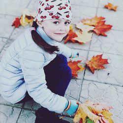 High angle view of girl on footpath during autumn