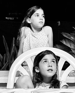 Portrait of young woman sitting and waiting for dinner