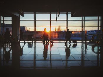 People in building during sunset