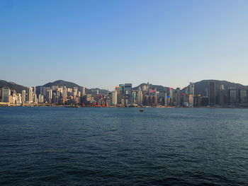 Sea with city in background