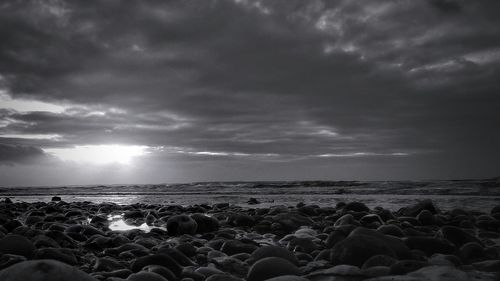 Scenic view of sea against cloudy sky