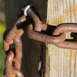 Close-up of padlock on rusty door