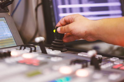 Cropped image of man using sound mixer 