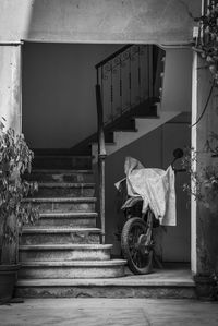 Full length of woman standing by railing