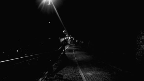 View of illuminated street lights at night