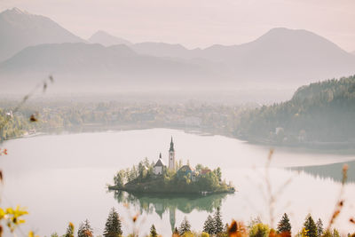 Scenic view of lake with mountain range in background