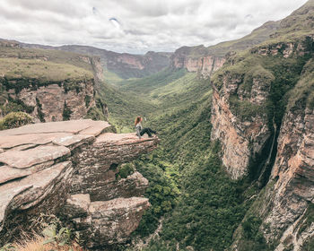 Rear view of man walking on mountain