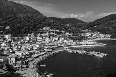 High angle view of townscape by sea