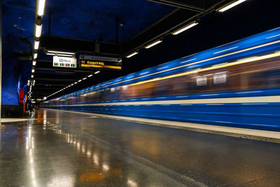Blurred motion of train at railroad station at night