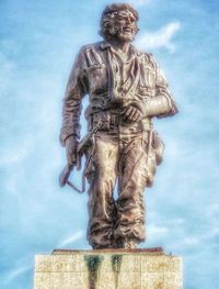 Low angle view of statue against sky