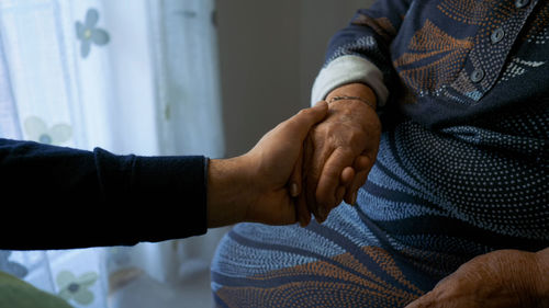 Close-up of hand holding hands