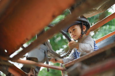 Boy driving vehicle