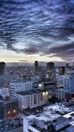 High angle view of city at sunset