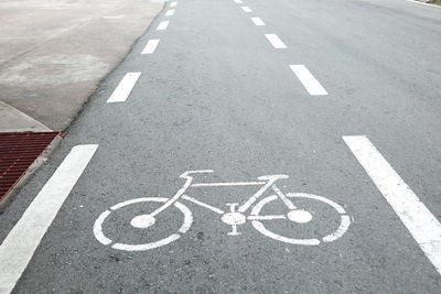 High angle view of arrow symbol on road