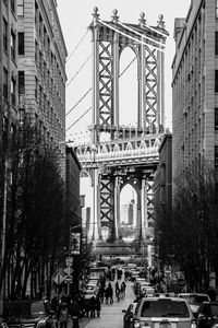 Low angle view of manhattan bridge in city