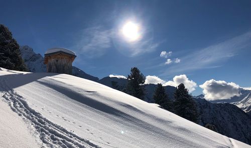 Scenic view of snow covered mountains against sky